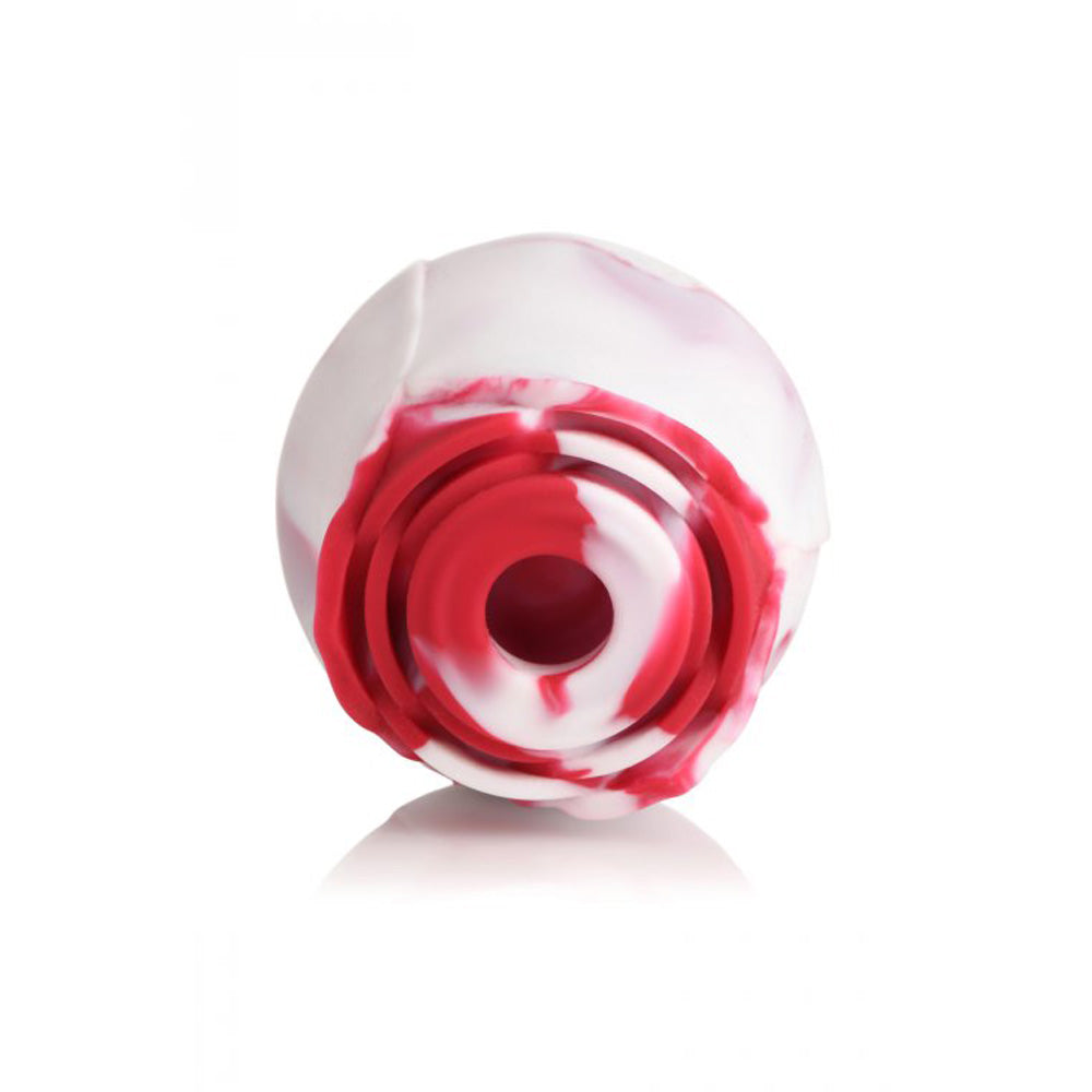 Red and white swirl silicone rose toy with faux roses.