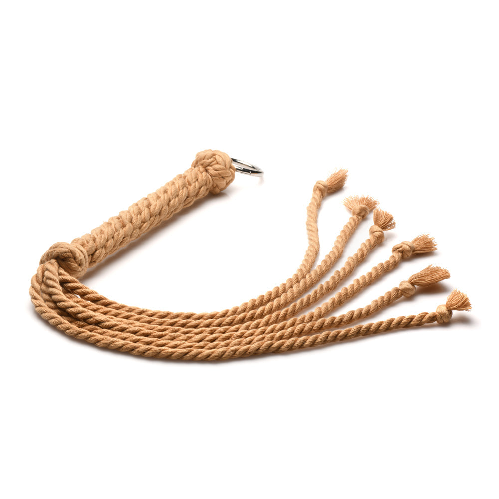 A tan rope flogger with six knotted tails and a metal ring.