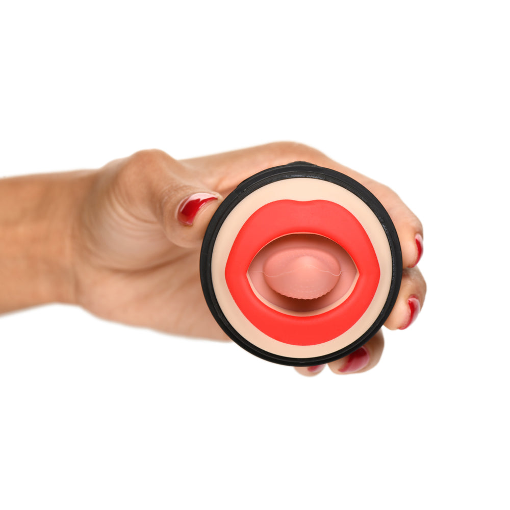 A hand holds a silicone oral stimulator shaped like lips with a tongue.