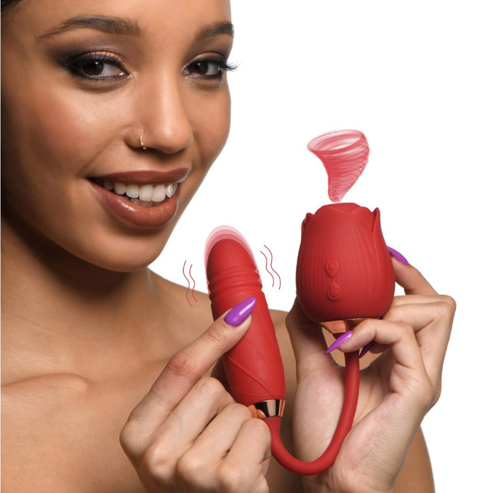 Red rose-shaped vibrator with a ribbed shaft and suction feature.