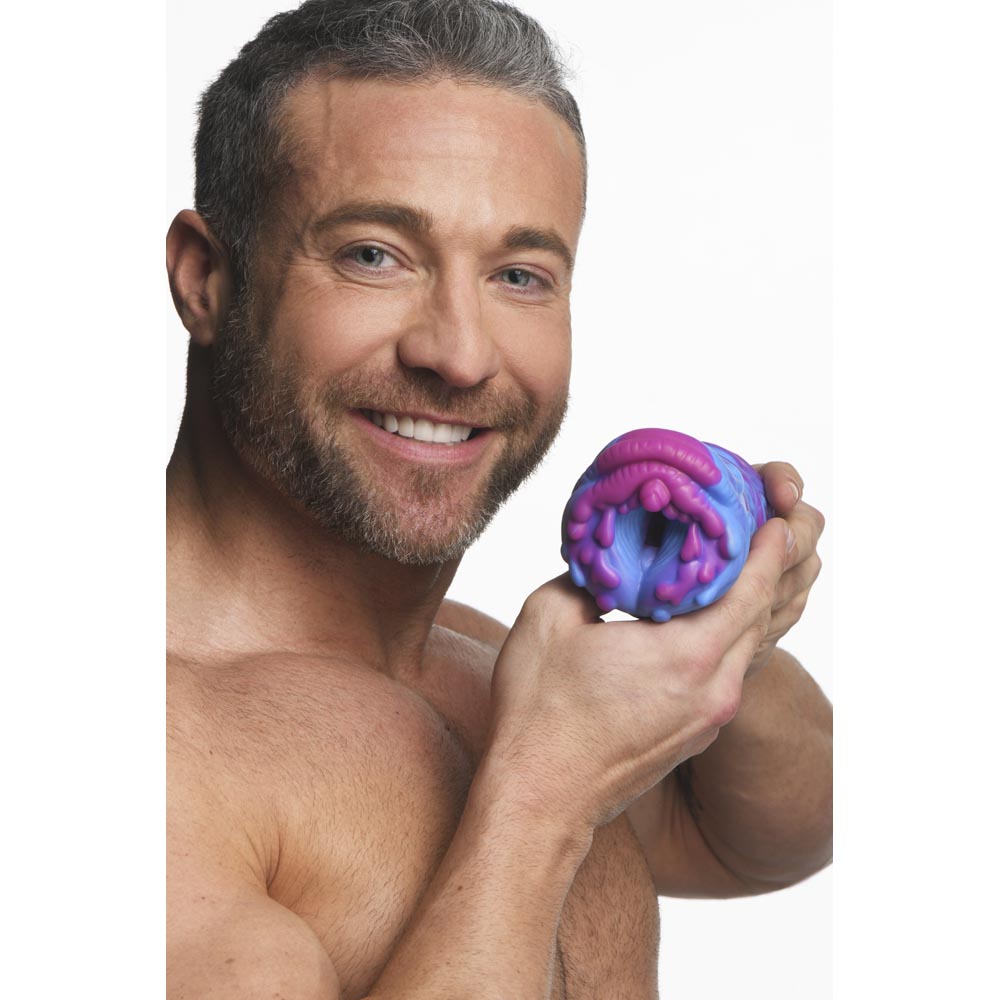 Cyclone Silicone Alien Fantasy Stroker in pink and blue.