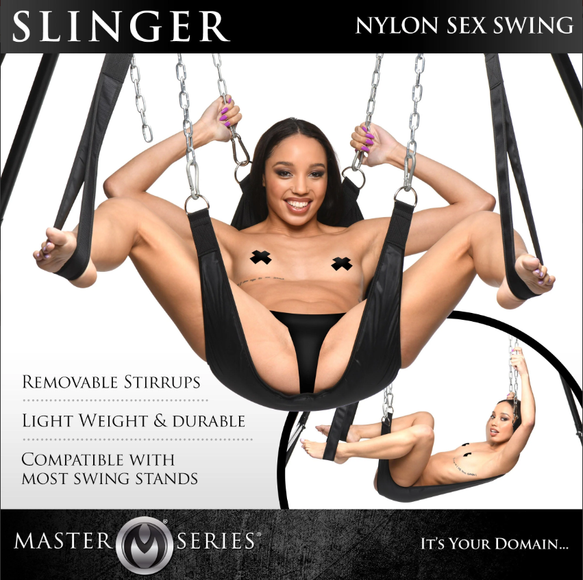 A woman is in a black nylon sex swing with removable stirrups.