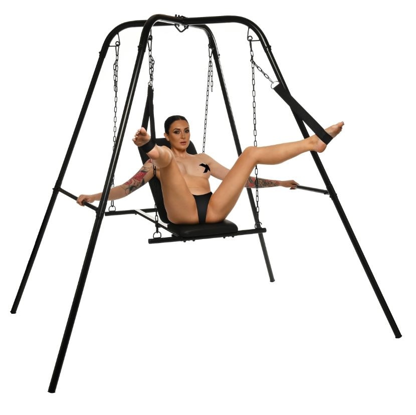 Adjustable steel sex sling with a woman seated in it.