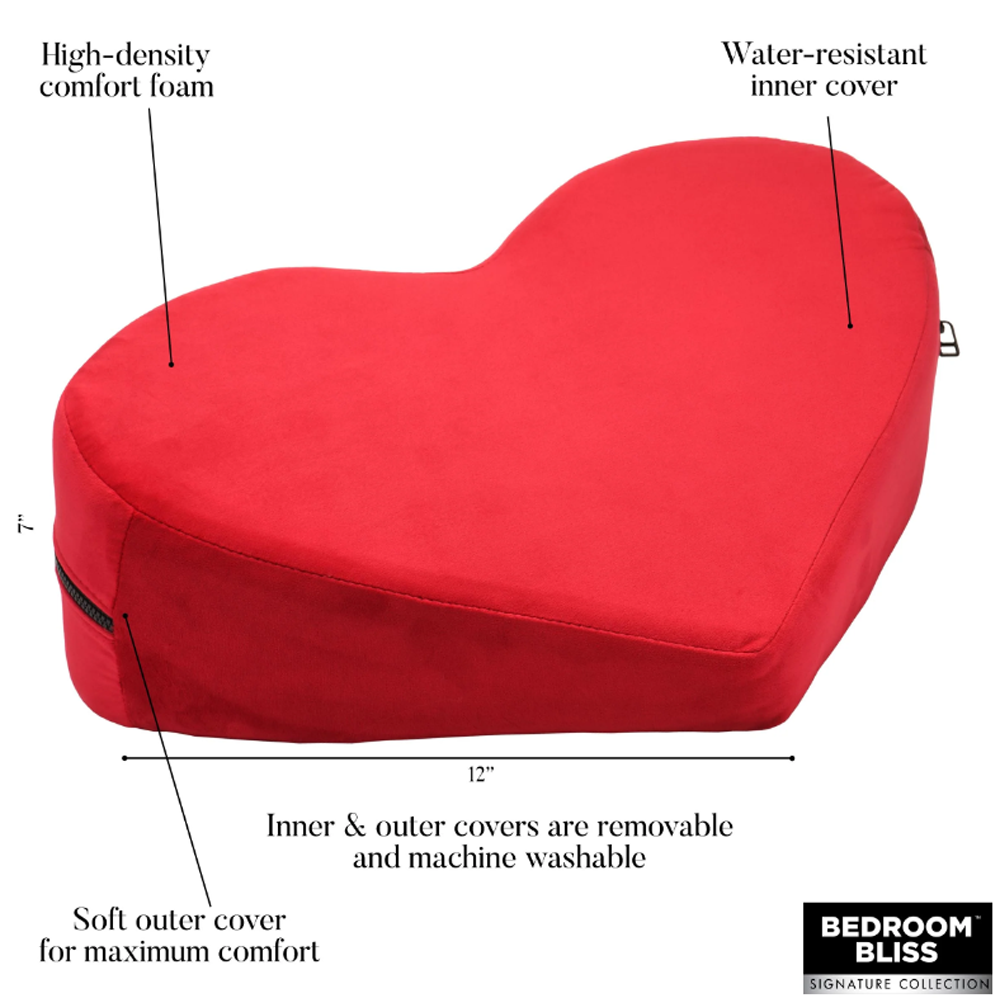 Red heart-shaped positioning pillow with removable covers.