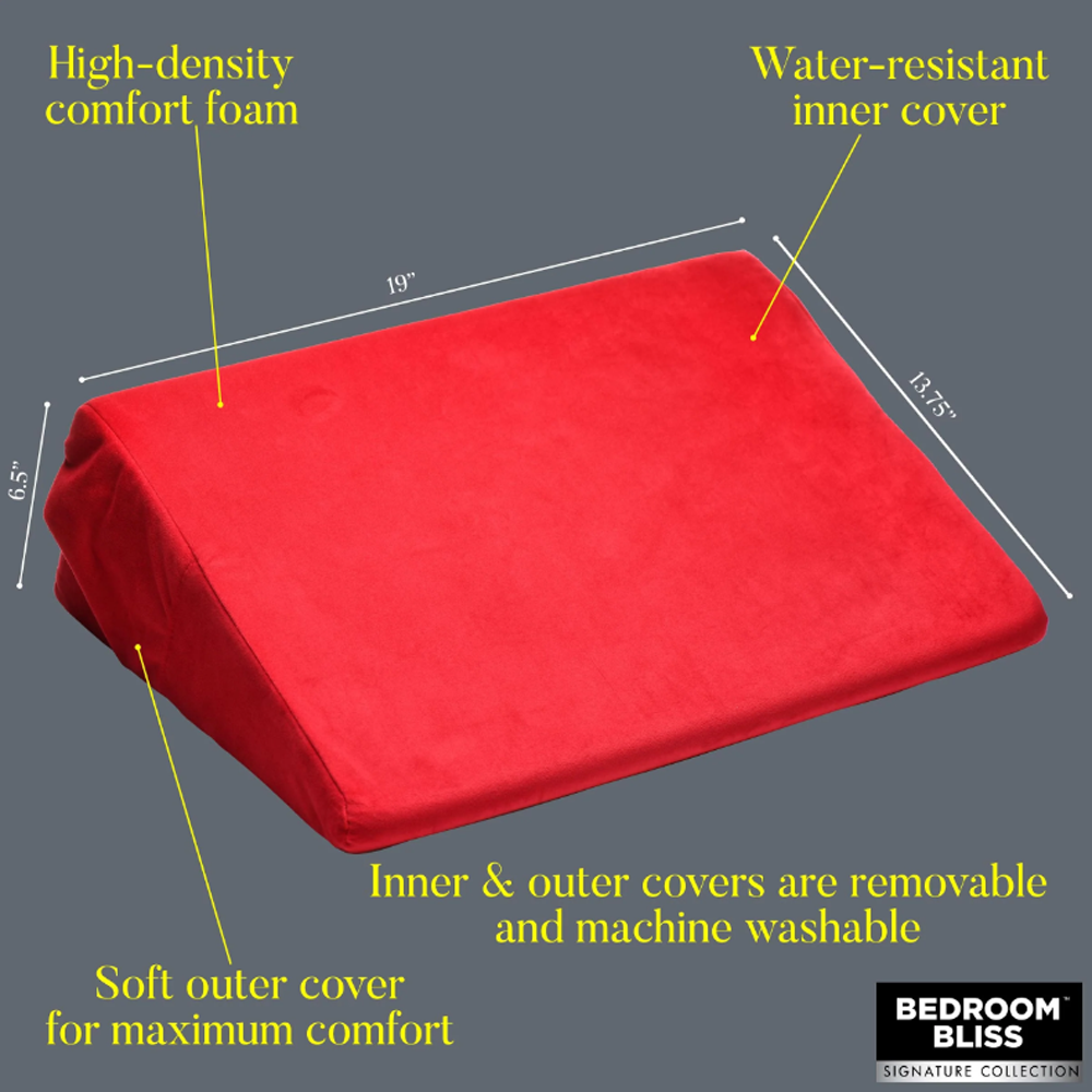 Red wedge pillow with dimensions 19" x 13.75" x 6.5" and removable covers.