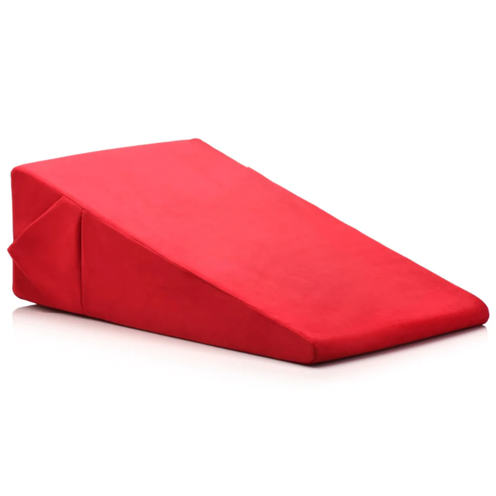 A large red wedge pillow made of high-density foam.