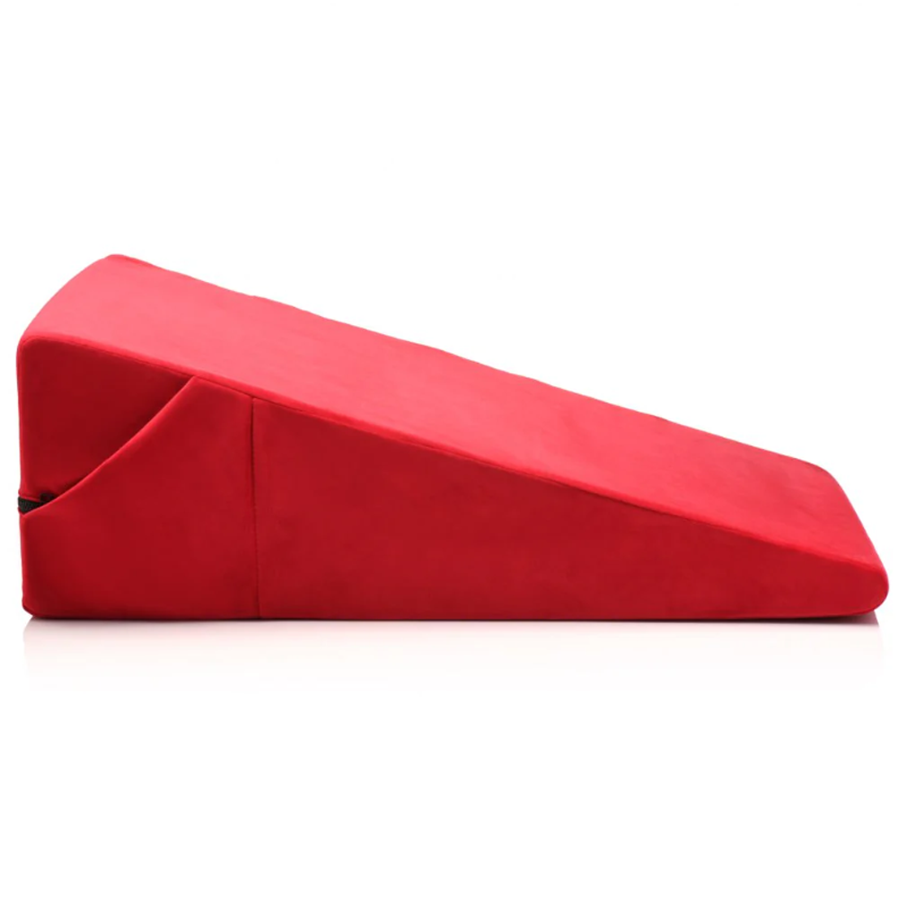 Red wedge pillow made of high-density foam.