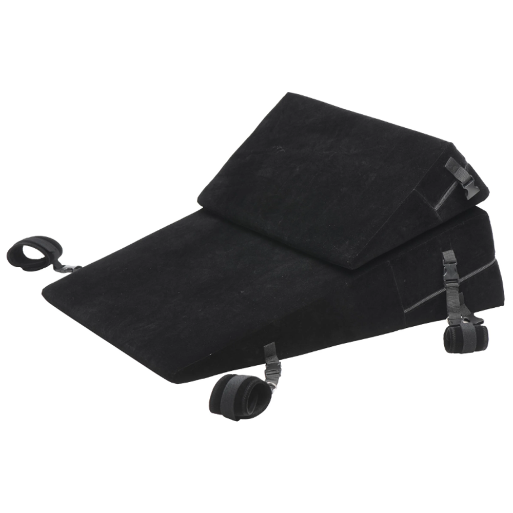 Black velvet bondage wedge pillow set with restraints.