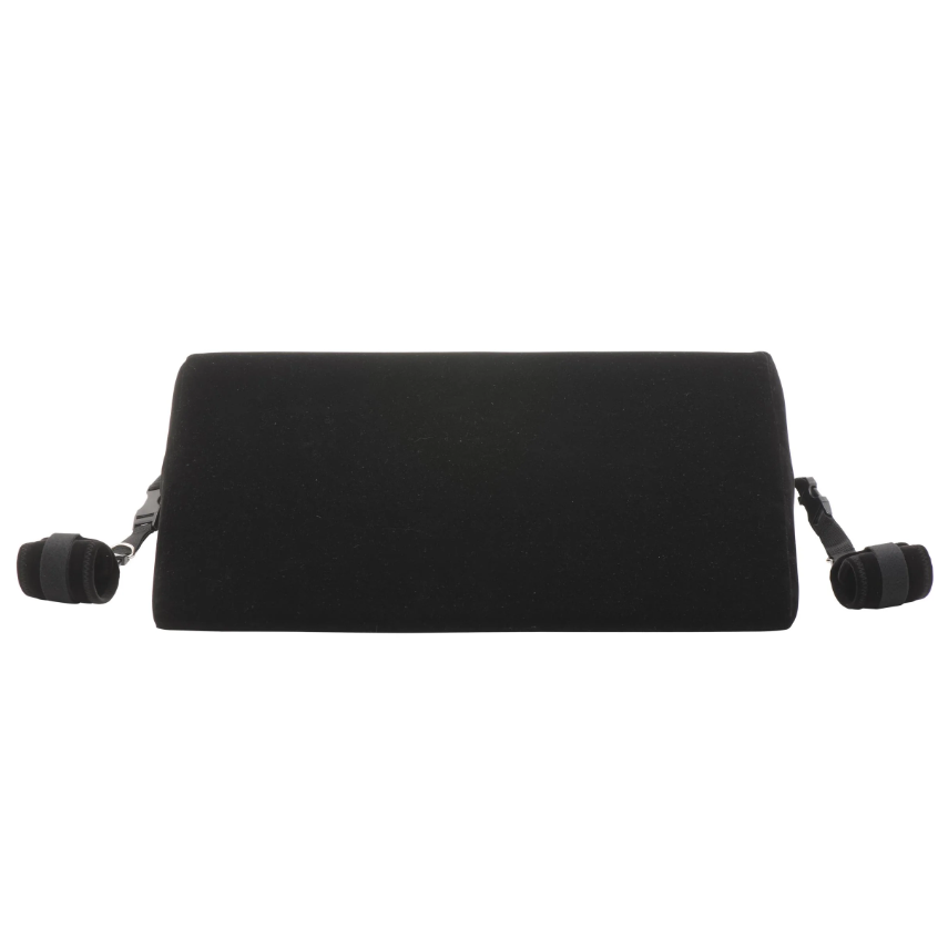 Black velvet bondage wedge pillow with restraint cuffs.