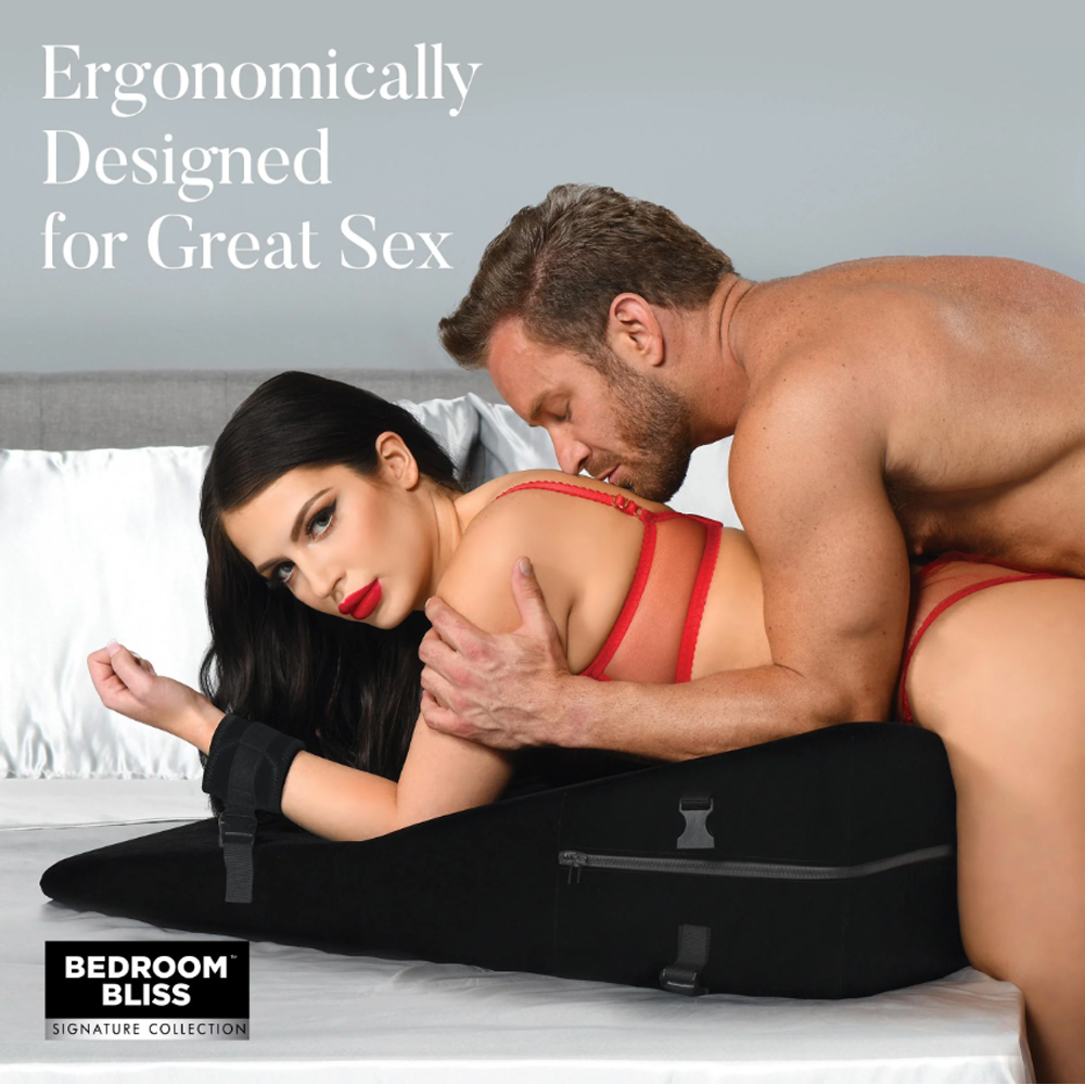 XL bondage wedge pillow with restraints and velvet cover.