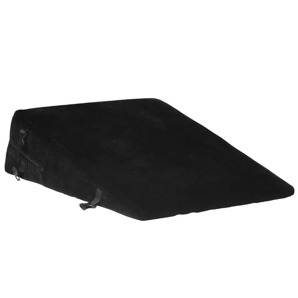 Black velvet wedge pillow with zippers and straps.