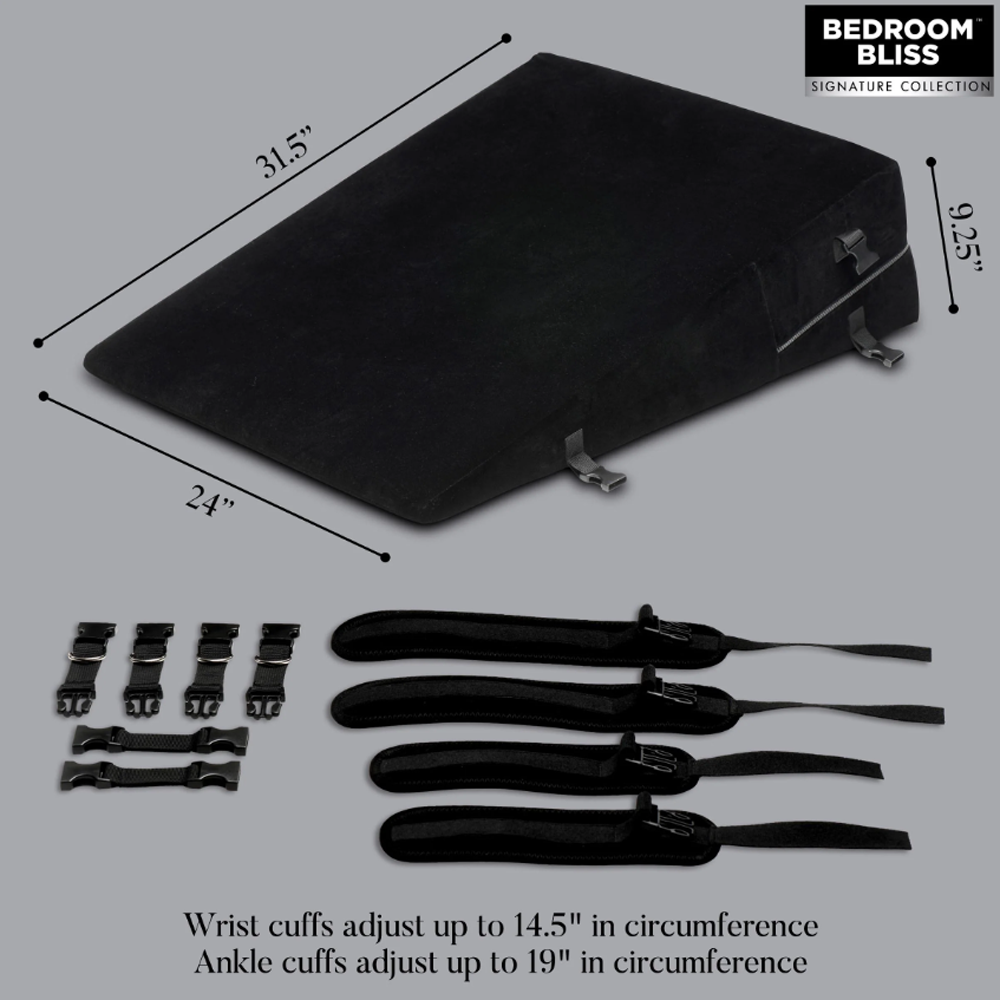 Black bondage wedge pillow with restraints and velvet cover.