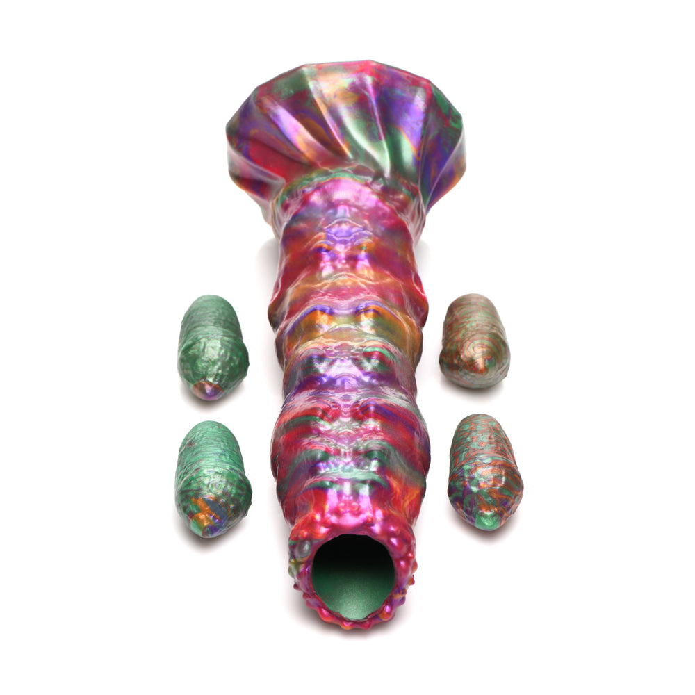 Iridescent fantasy dildo with ribbed texture and four larva eggs.