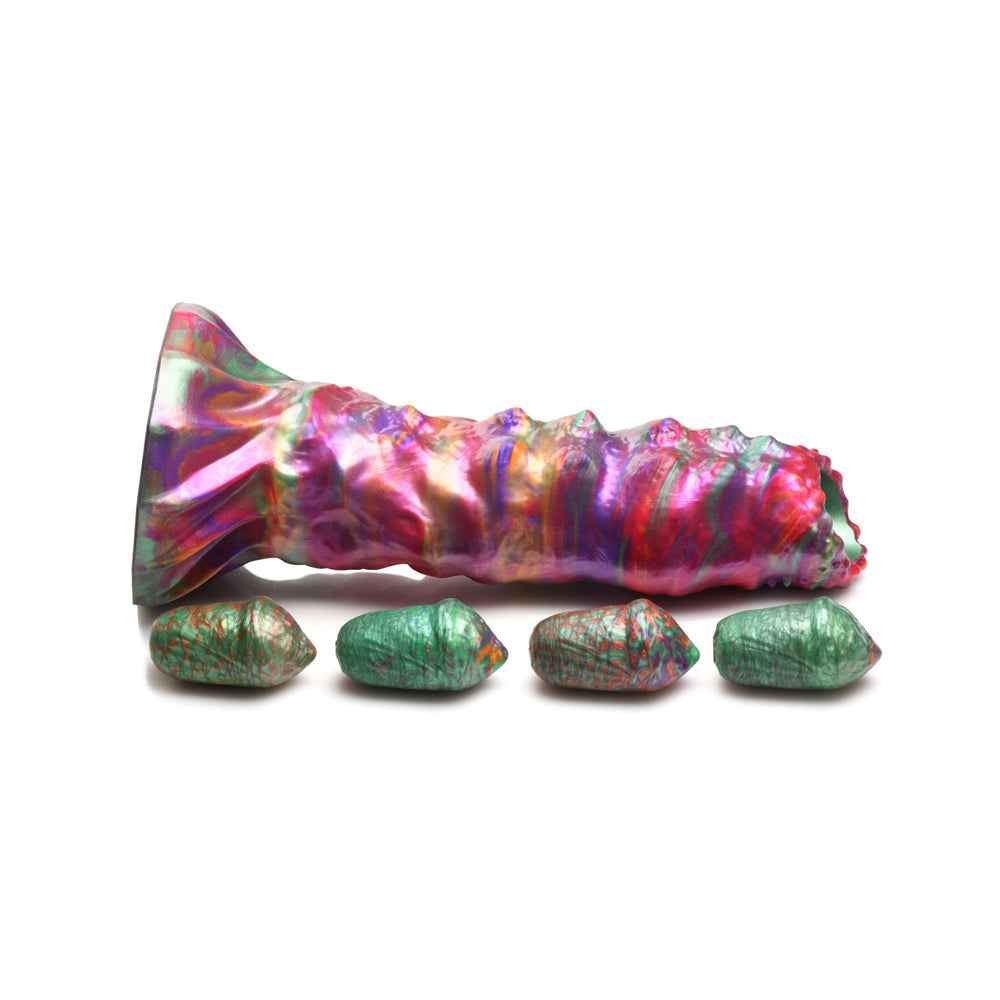 Iridescent fantasy dildo with ribbed texture and four green eggs.