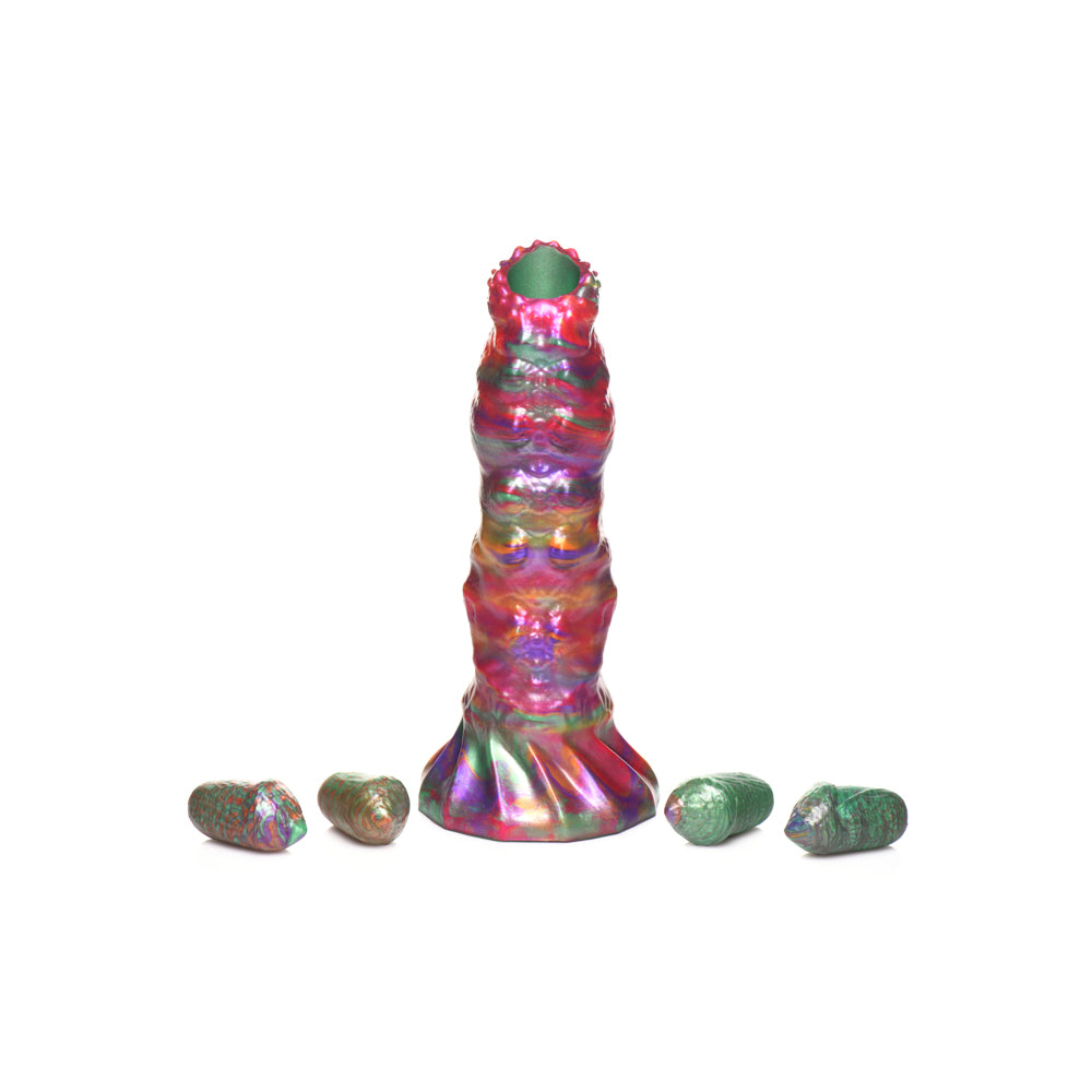 Iridescent silicone larva ovipositor dildo with four eggs.
