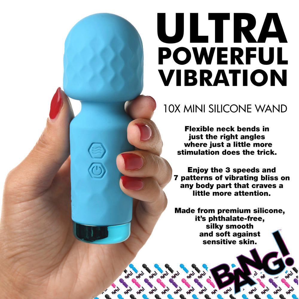 A blue silicone wand vibrator held in a hand with red nail polish.