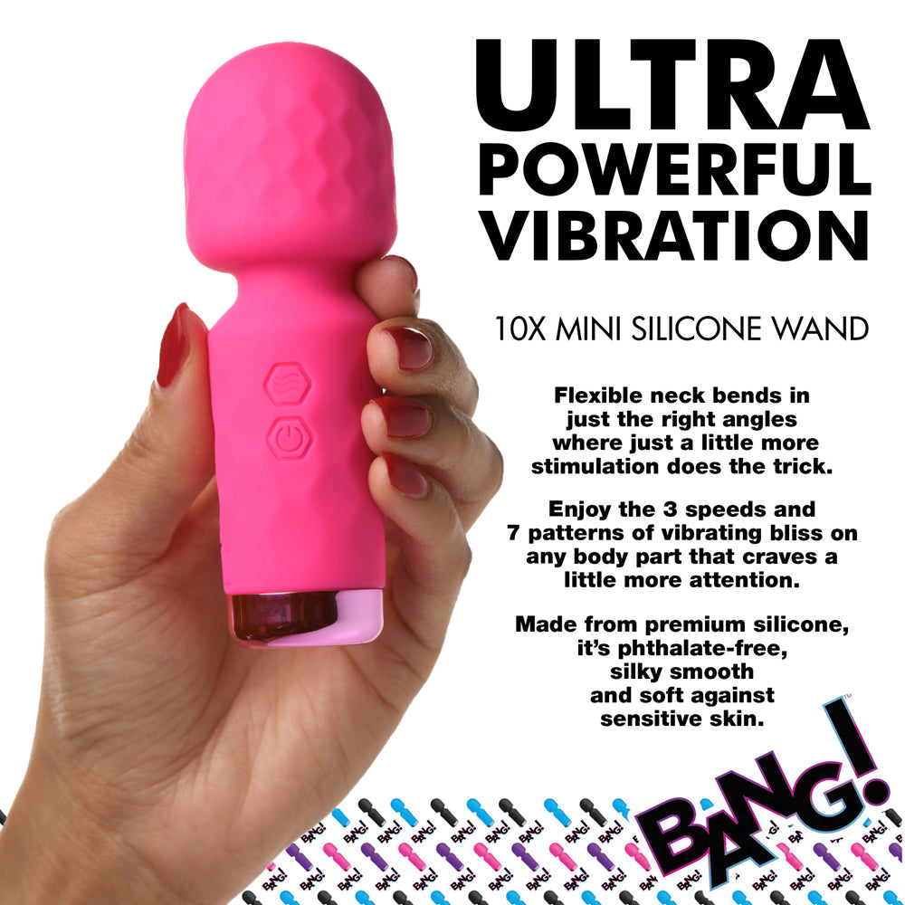 A pink mini silicone wand vibrator held in a hand, with text describing its features.