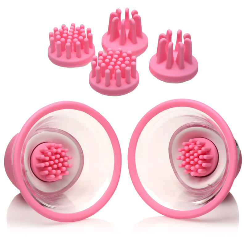Pink silicone nipple suckers with rotating stimulators and interchangeable attachments.
