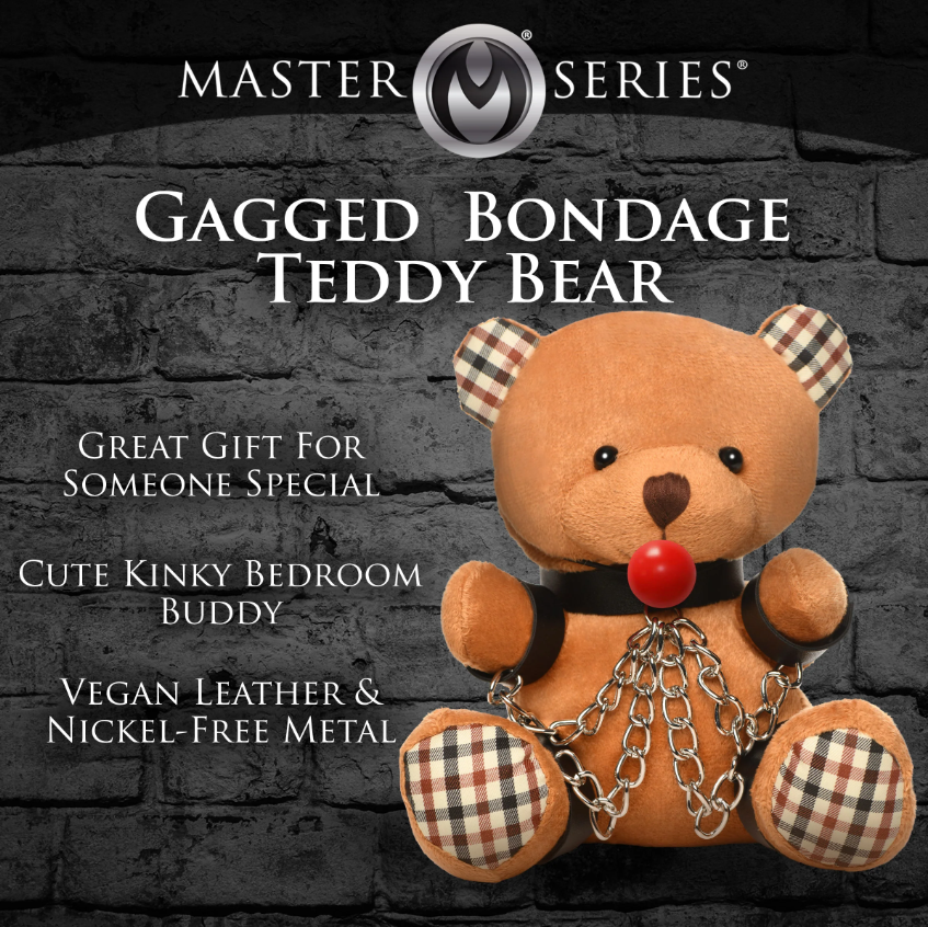 A brown teddy bear with a ball gag, wrist cuffs, and chains.