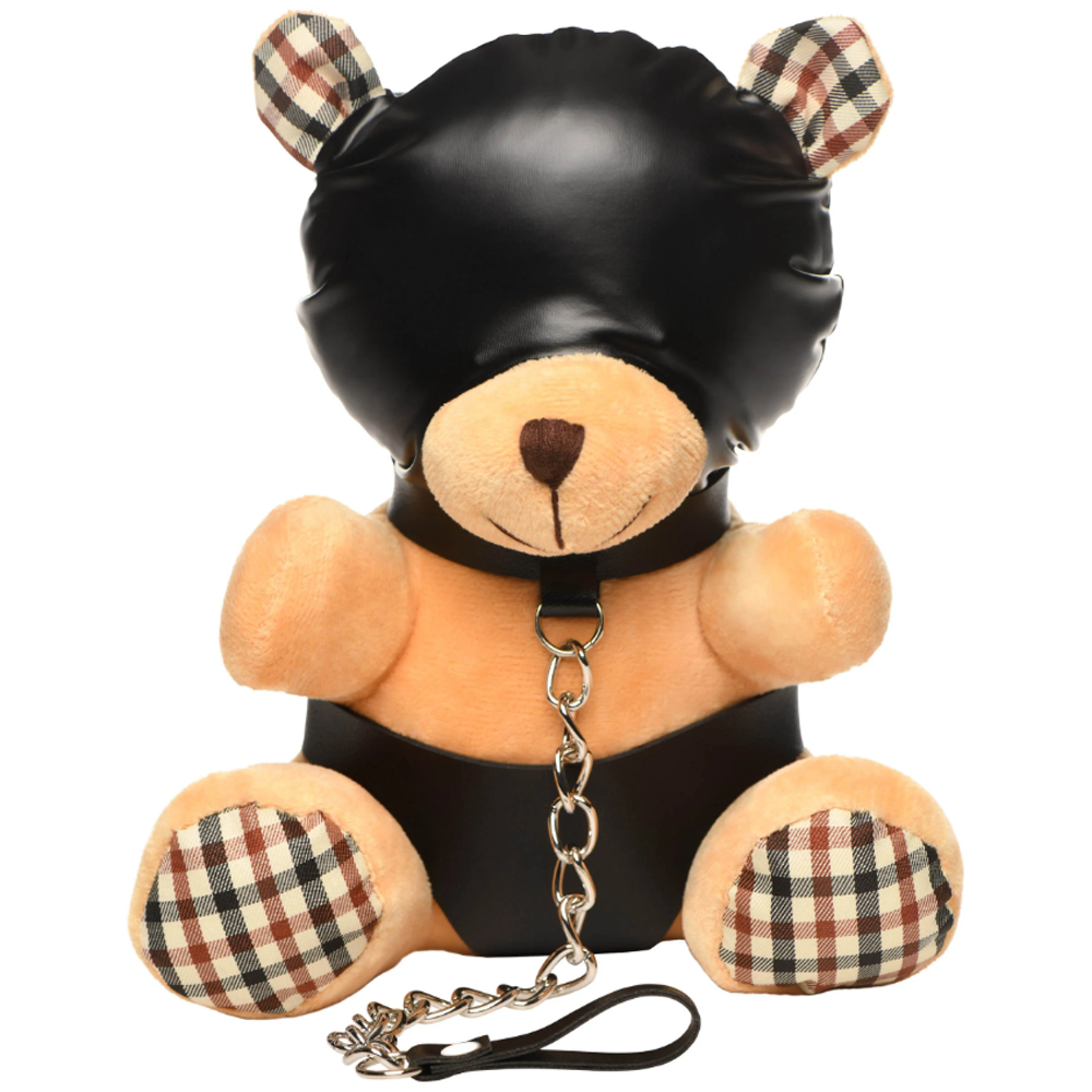 A plush teddy bear wearing a black hood and collar with a chain leash.