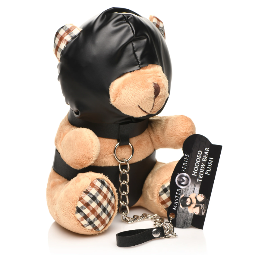 A plush teddy bear wearing a black hood and collar with a chain leash.