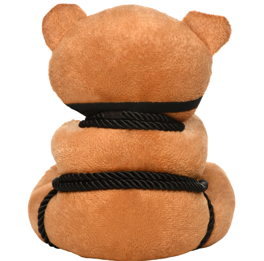 Brown teddy bear plush with black rope accents and a black blindfold.