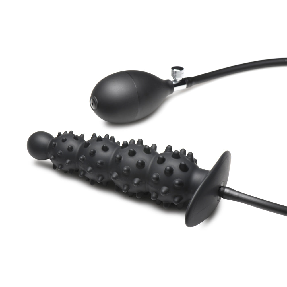 Inflatable nubbed silicone anal plug with a bulb pump.