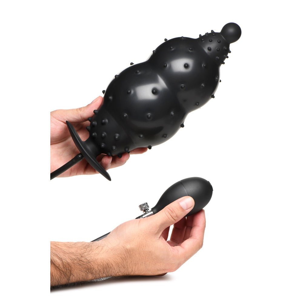 Inflatable nubbed silicone anal plug with a hand pump.