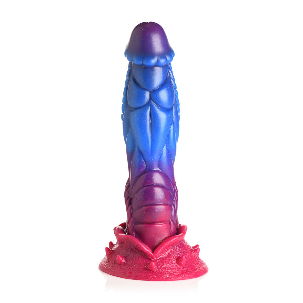 Purple-to-blue-to-pink alien silicone dildo with textured ridges and suction cup base.