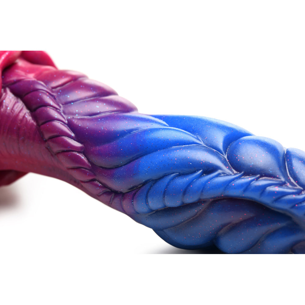 Alien dildo with purple, pink, and blue glitter gradient and textured ridges.