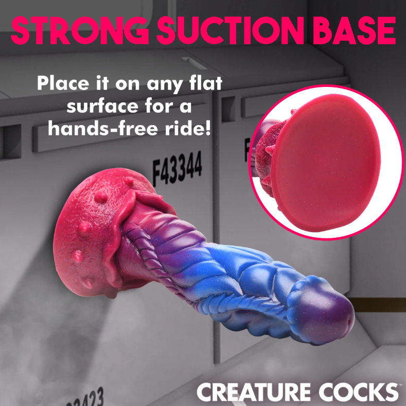 Alien-shaped silicone dildo with suction cup in pink, purple, and blue.