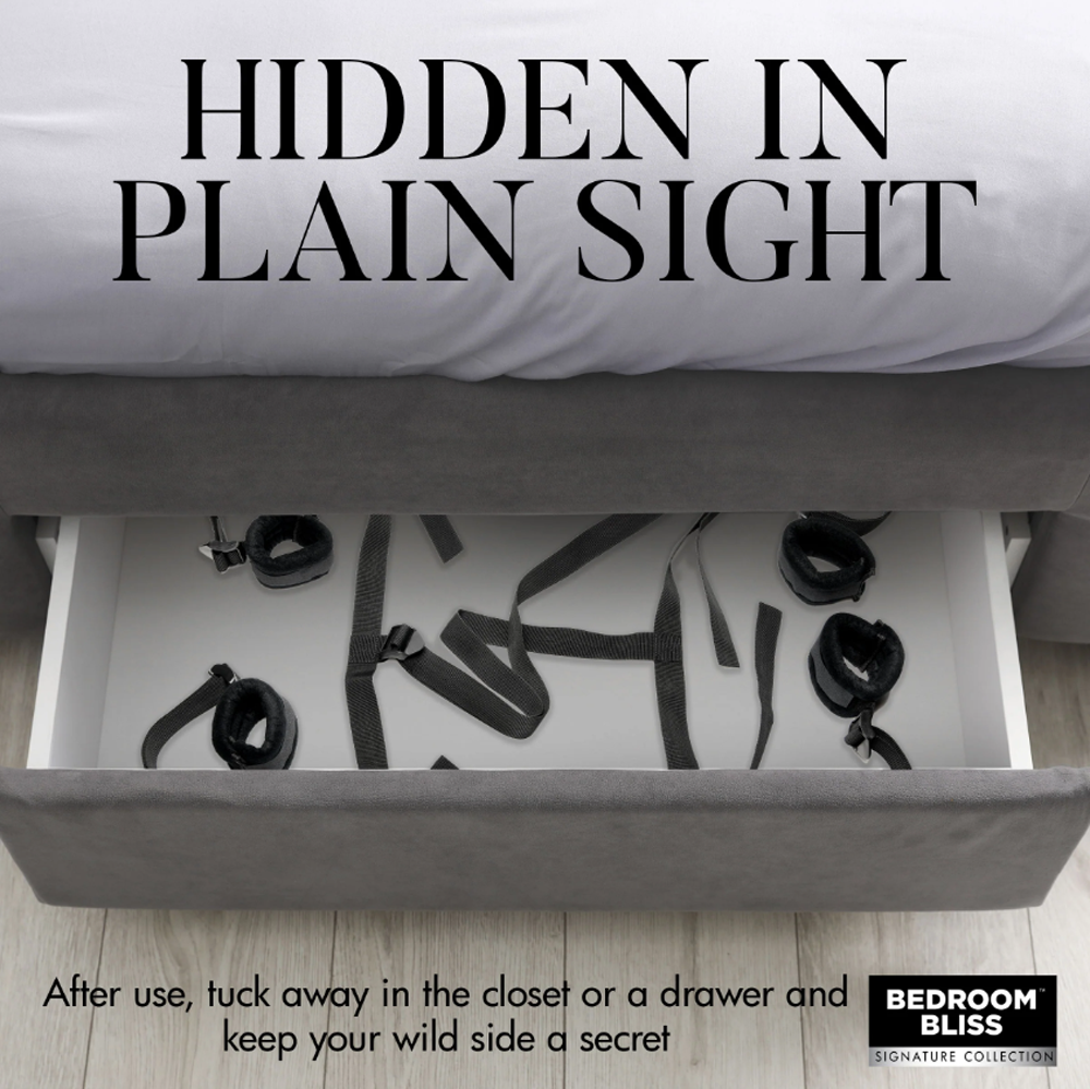 Black padded cuffs and straps for bed restraints.