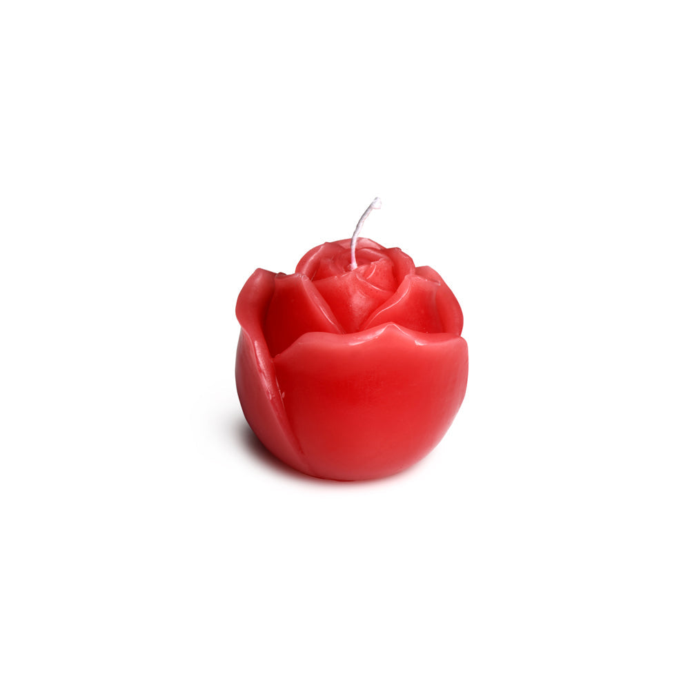 Red rose-shaped candle with a white wick.