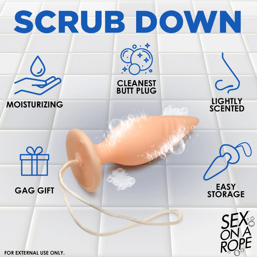A peach-colored butt plug shaped soap on a rope, lightly scented and moisturizing.