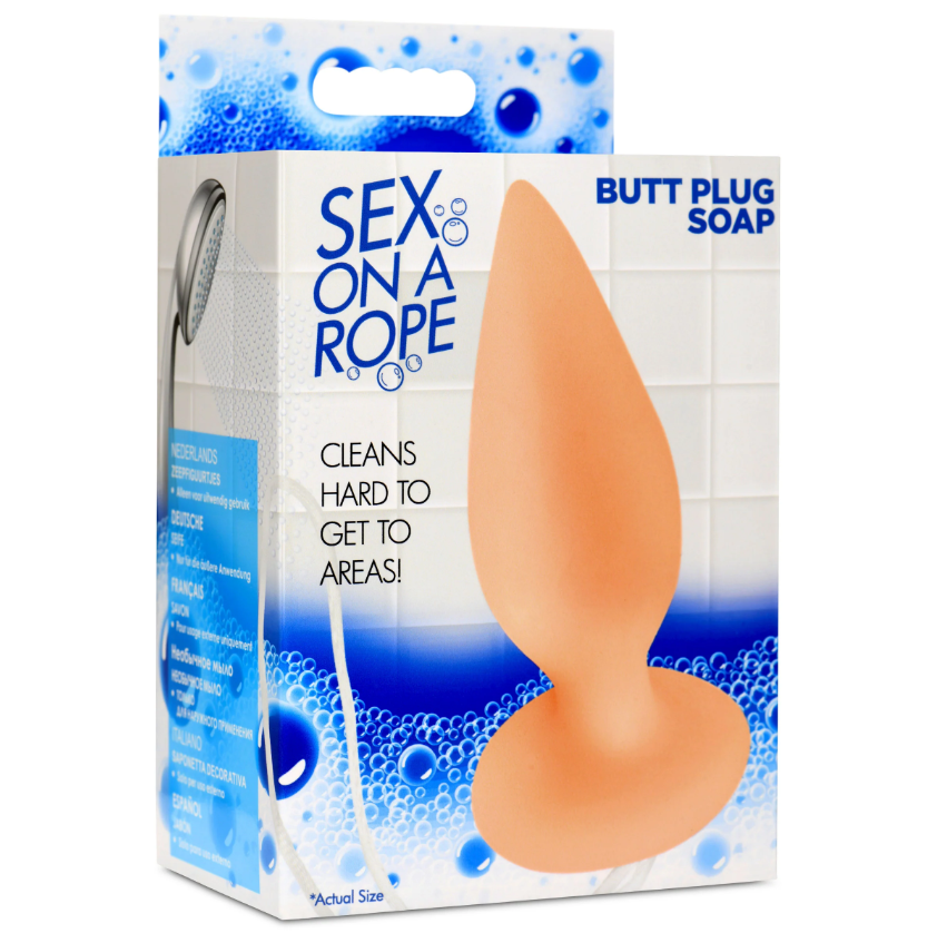 A peach-colored butt plug shaped soap on a rope.