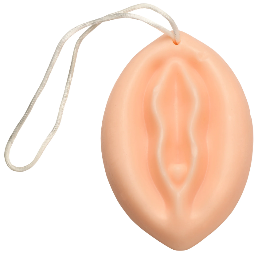 Peach-colored vulva-shaped soap with a hanging rope.