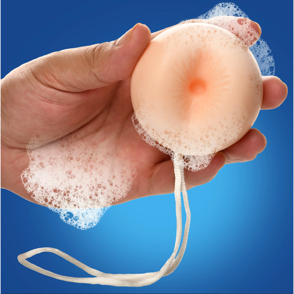 Peach-scented soap shaped like a butt plug with a rope.