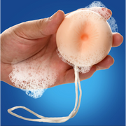 Peach-scented soap shaped like a butt plug with a rope.