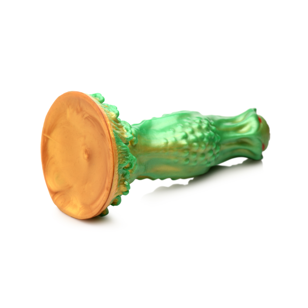 Green silicone dildo with a gold suction cup base and red eyes.