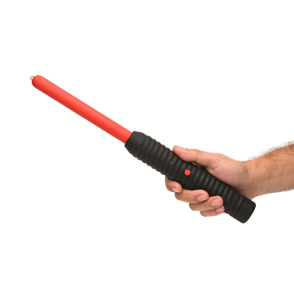 Red and black electric zapping wand with ribbed grip held in a hand.