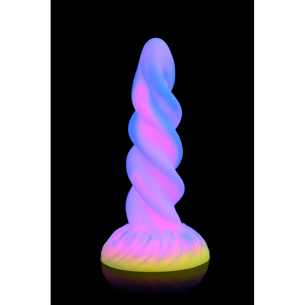 A glow-in-the-dark silicone dildo with a spiral unicorn horn design.