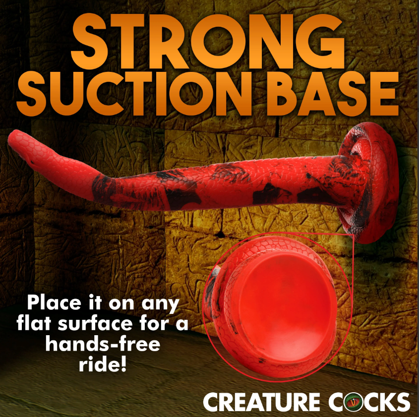 A red fantasy dildo with a suction cup base and snake-like texture.