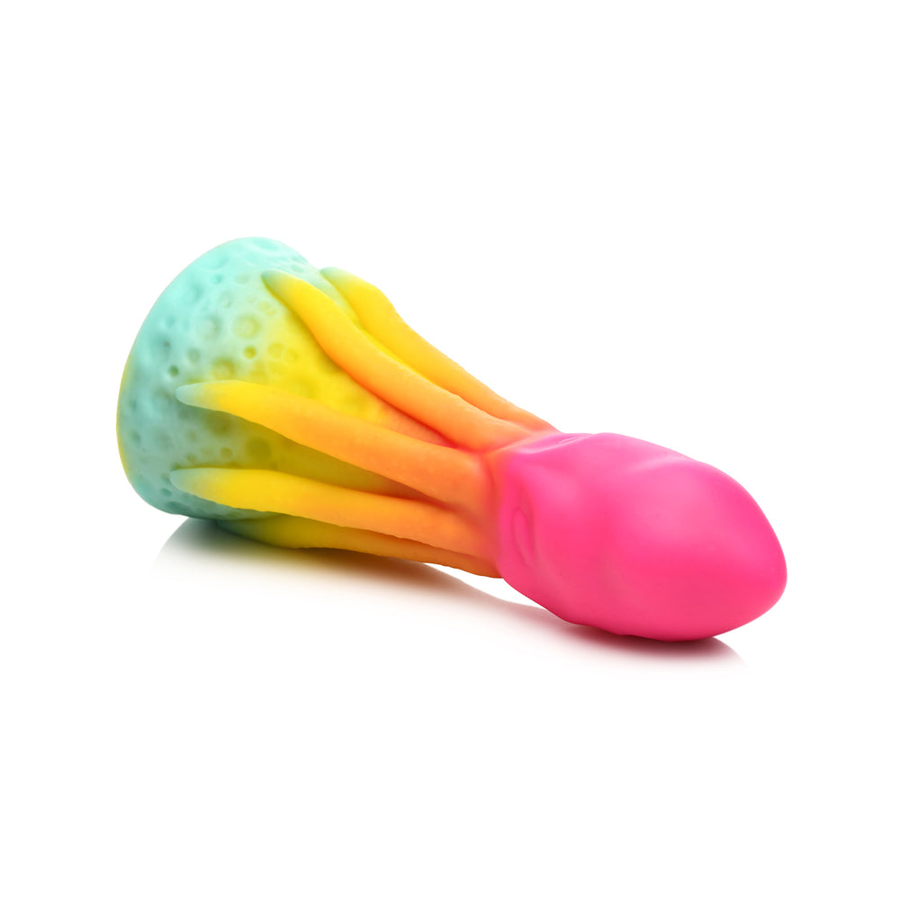 A rainbow-colored silicone dildo with textured tentacles and a suction cup base.