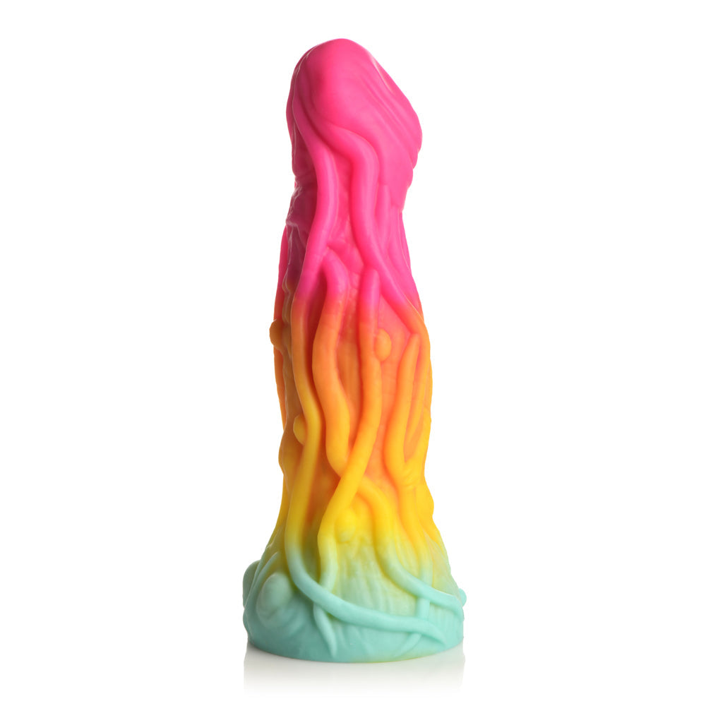 Rainbow gradient silicone dildo with tentacle-like texture and suction cup base.