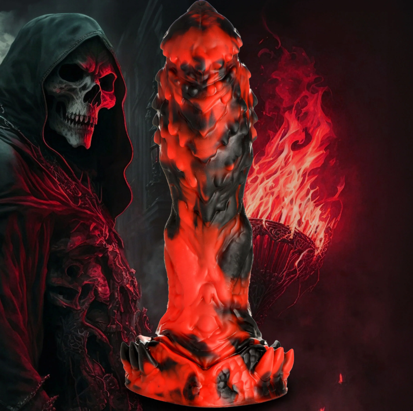 Textured red and black silicone dildo with a skull-like figure and flames in the background.
