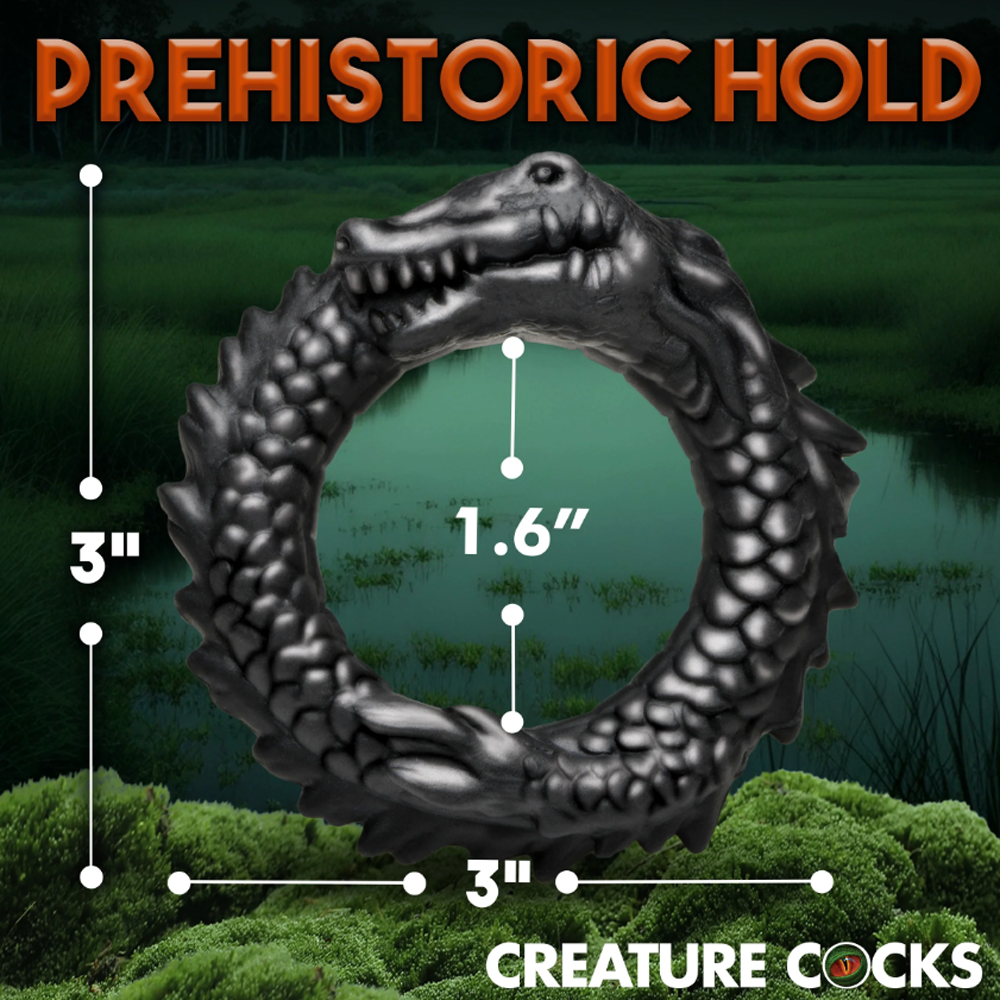 Black silicone caiman-shaped cock ring with 3 inch diameter and 1.6 inch inner diameter.
