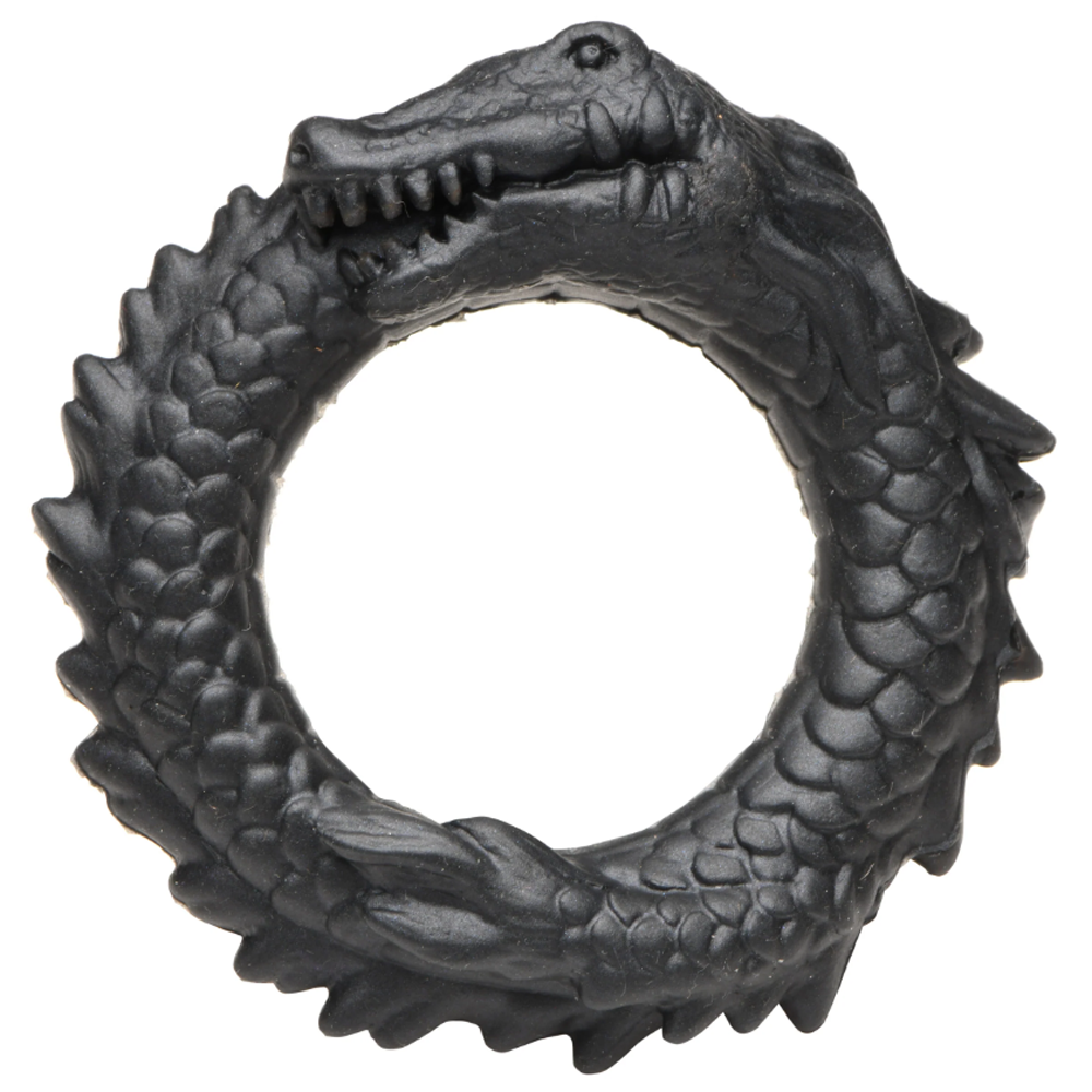 Black silicone cock ring shaped like a caiman biting its tail.