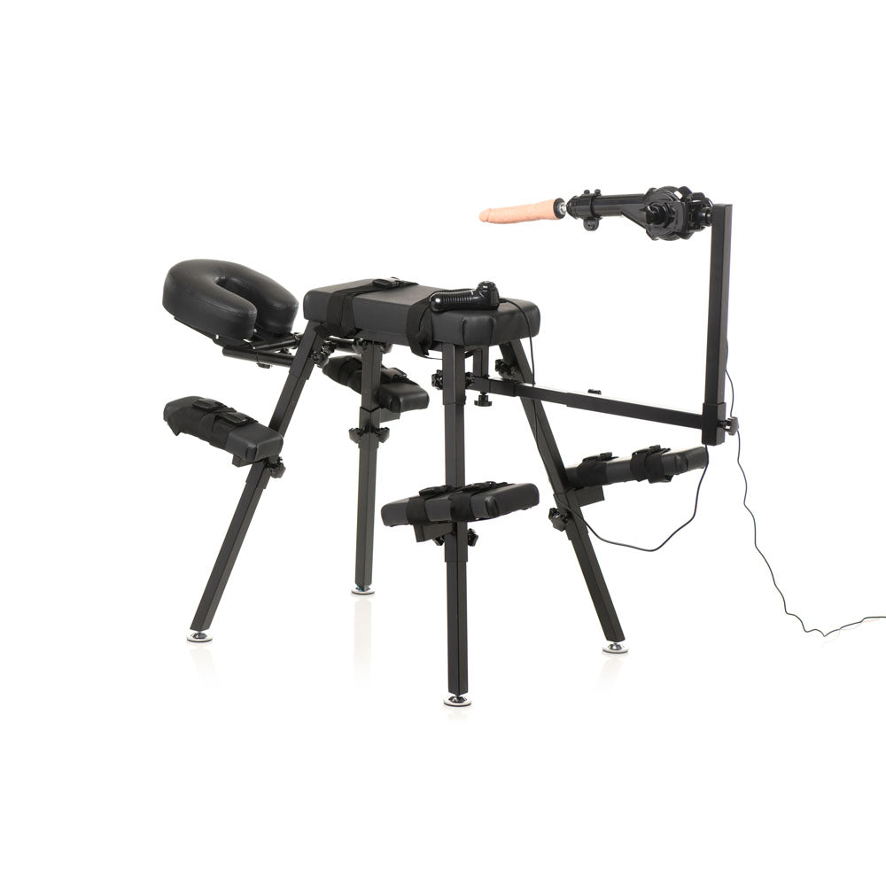 Black obedience bench with a sex machine and dildo attached.