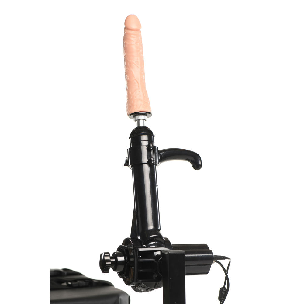 A sex machine with a dildo attachment on an obedience bench.