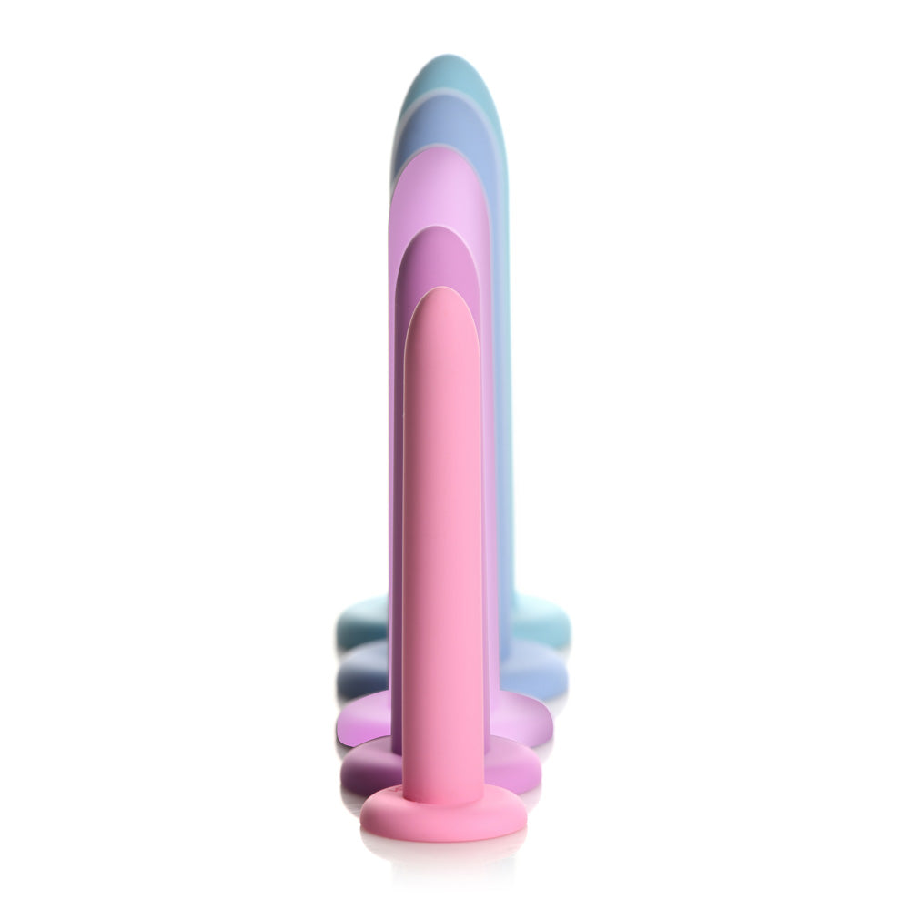 A set of five silicone pelvic dilators in graduated sizes and pastel colors.